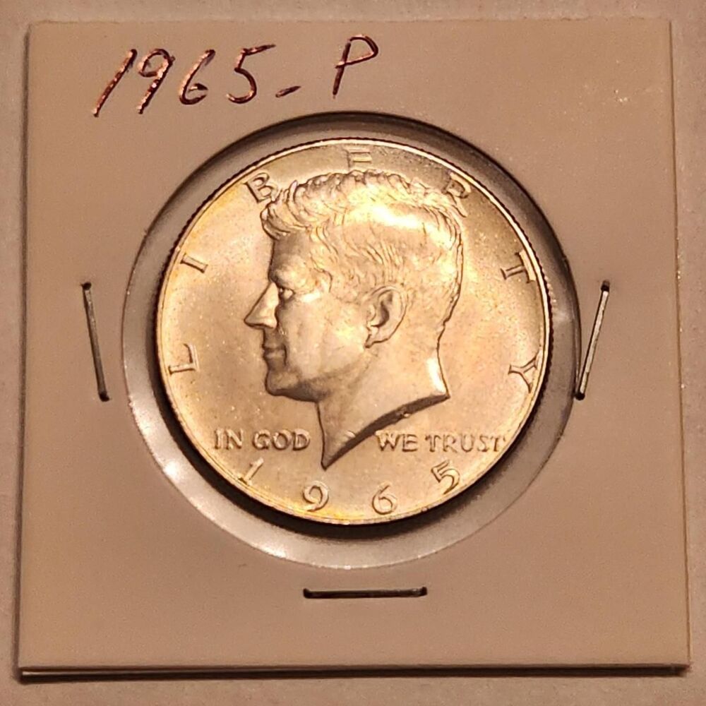 This coin is a 1965 Kennedy Half Dollar in...